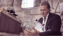 SPG member Marco looking at glass